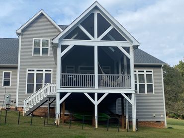 Timber frame style screened addition. 6x6 timbers.Open Gables Skylights Handrails Staircase Painted