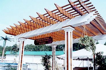 Award-winning custom-built wooden pergola with columns for our Southern Ideal Home Show display