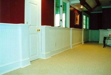 Basement Remodel with tray ceilings, recessed lighting, wainscotting, and beadboard paneling