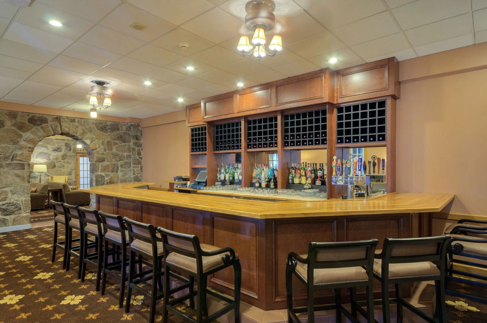 Finished lodge interior with bar and gathering area — hospitality construction project completed on the Georgia coast.