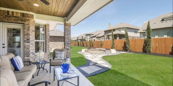 Backyard landscape with fire pit and privacy screen