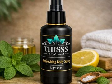 Bottle of THISSS Refreshing Body Spray with natural ingredients.