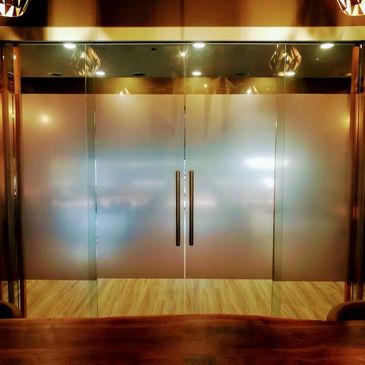 Bronze frosted film on glass sliding doors.