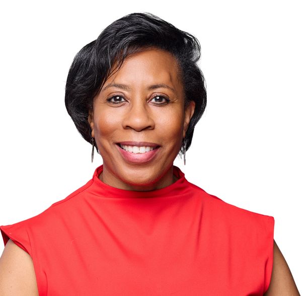 Dr. Paula C. Perez in a red top.