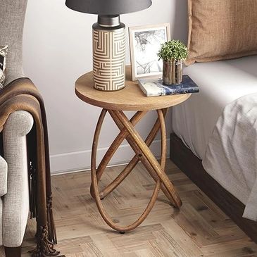 Wood side table with multiple ovals angled as the base