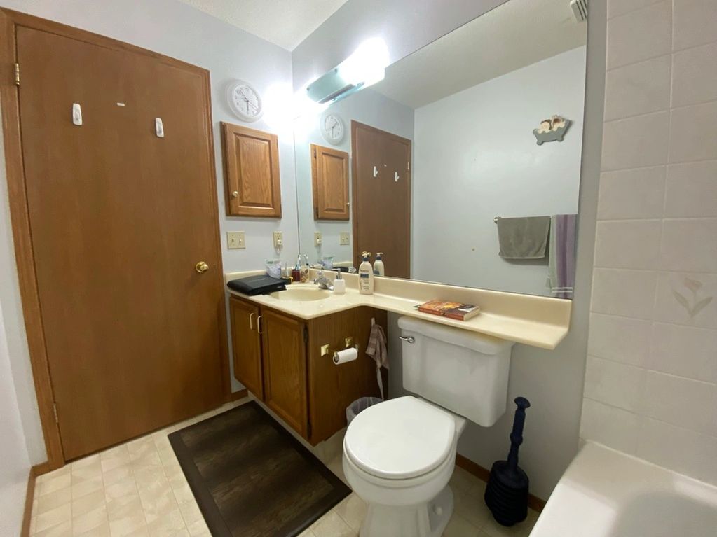 Same 70's bathroom other view with original wood cabinet & medicine cabinet, wood trim