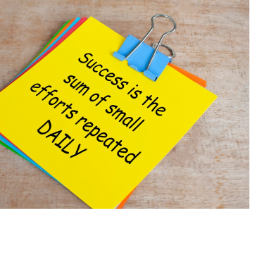 Inspirational quote on a colorful card clipped with a blue binder clip.