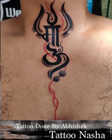 Tattoo Nasha, the divine symbols of Om and Trishul intertwine with grace and reverence.