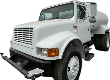 Newly refurbished white 2000 International 2,000 gallon epoxy-lined water truck