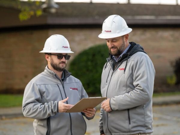 Two engineers on a site-visit.