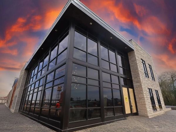 Building with vivid sunset sky above.
