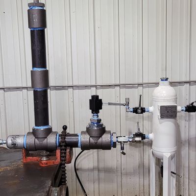 Industrial piping and filtration system inside a facility.