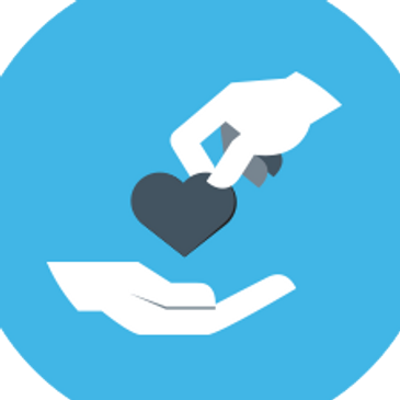A hand giving a heart to another open hand symbolizing care and generosity.
