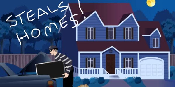 Burglar stealing valuables from a home at night.