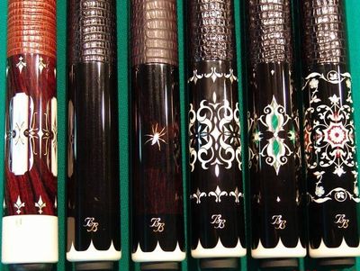 A collection of Black Boar custom cues.