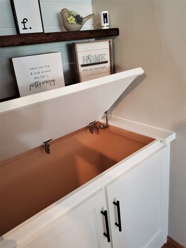 Flip-up hinges on built-in painted wood top