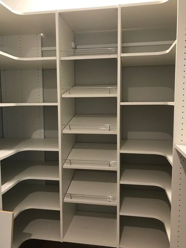 Closet storage with plentiful adjustable shelving and shoe shelves in the middle