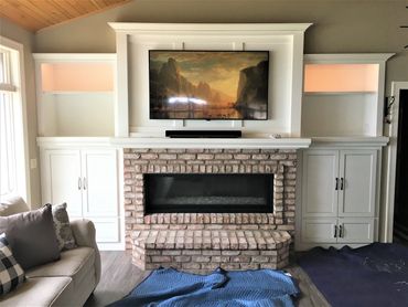 New construction fireplace surround with light-up uppers