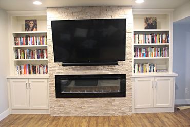 Entertainment center with adjustable shelving for book storage 