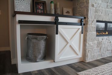 X Sliding barn door on fireplace built-in