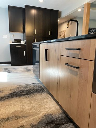 Rustic white oak stained island featuring gold and black accented hardware