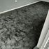 a black color carpet on the floor in a room 