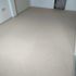 an off white color carpet on the room floor 