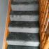 front view of the stairs with gray mat on it