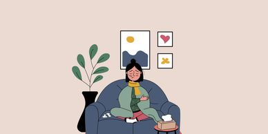 Person meditating at home with a cat nearby.