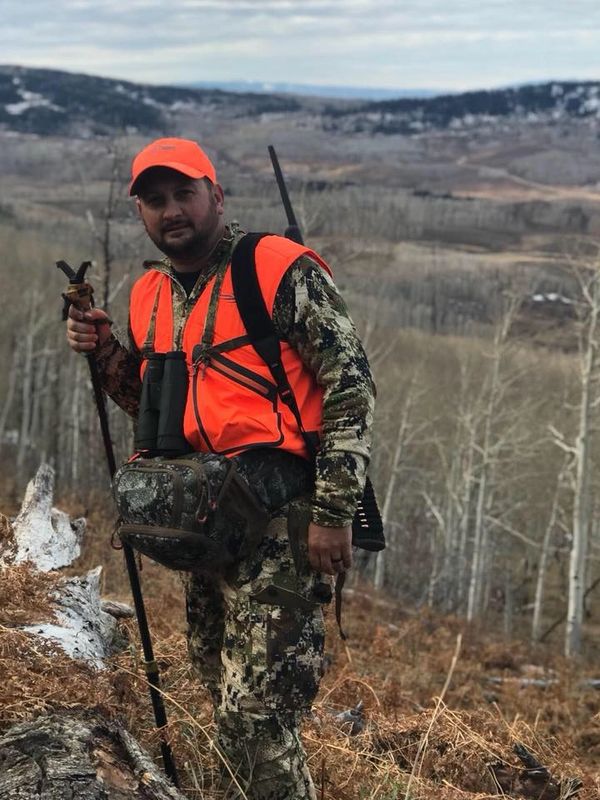 Hunter hiking on mountain