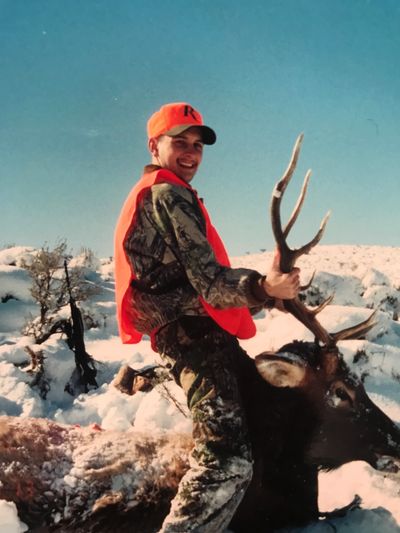 Hunter with bull elk