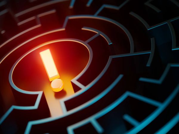 Glowing exclamation mark in the center of a dark maze.