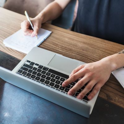 Someone using a computer to write