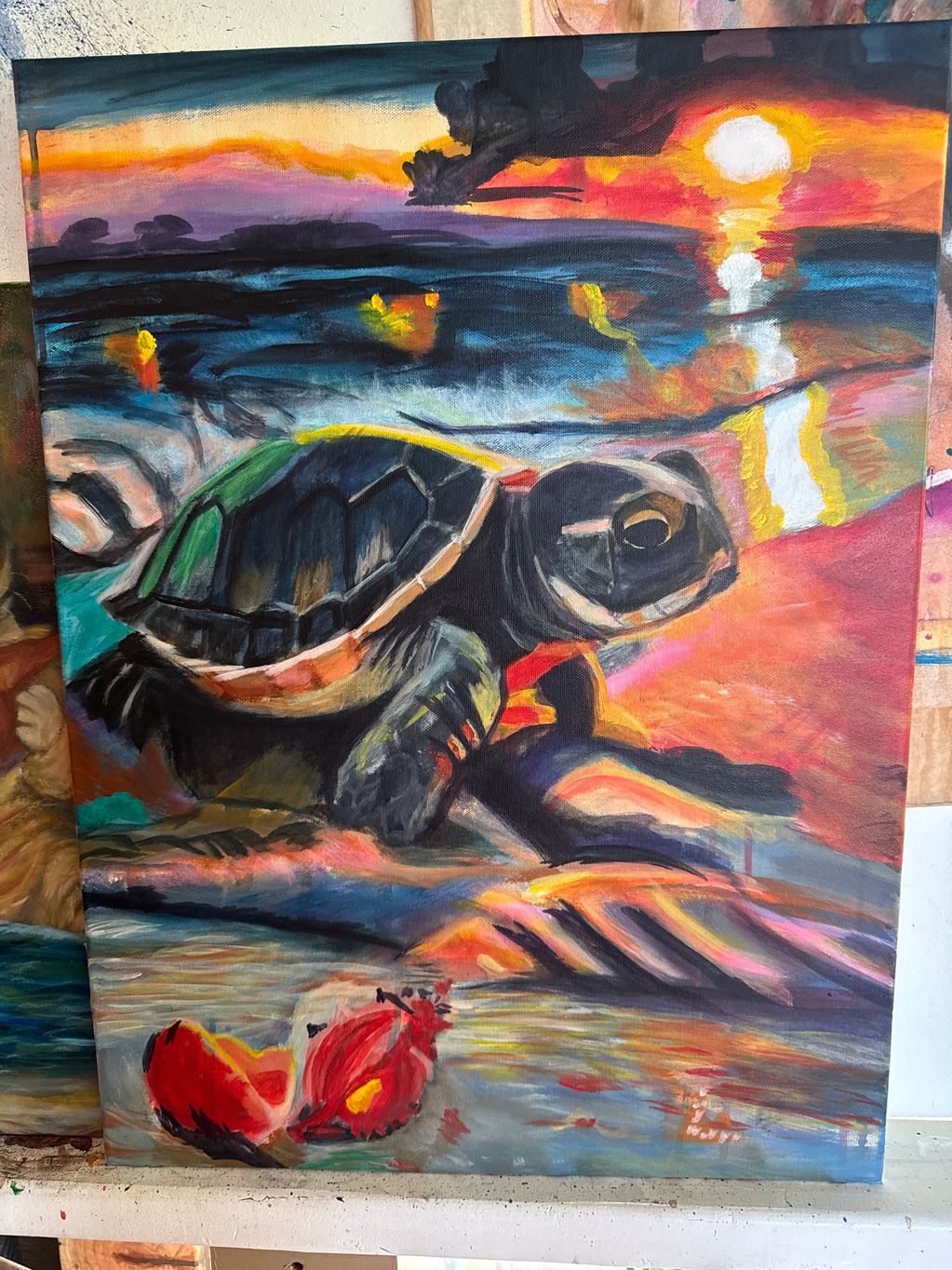 A colorful painting of a turtle at sunset on the beach.