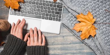 Hands of an SME ready for writing alt-text, assessments and elearning courses.