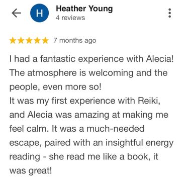 Five-star review praising Alecia's Reiki session and welcoming atmosphere.