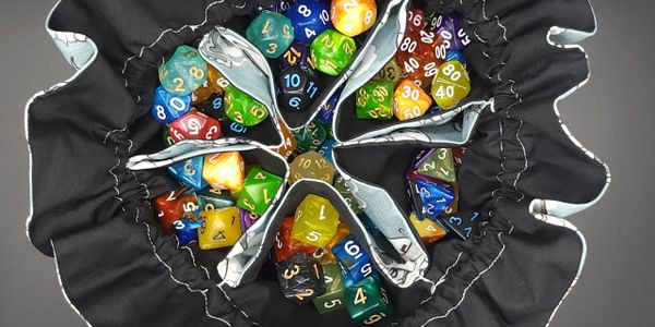 Inside our dice bags, showing the pockets included in each