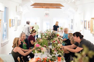 Group of designers learning floral arrangemnents.