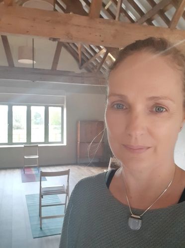 Laura, chair yoga teacher at The Sanctuary Within  preparing for a chair yoga class in Norfolk 
