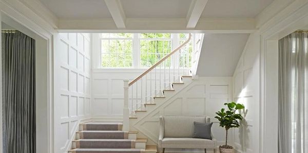 stairs with wood accents on the wall