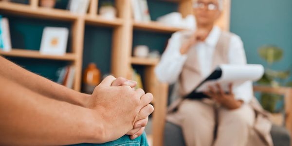Counselor and patient doing psychotherapy in the office