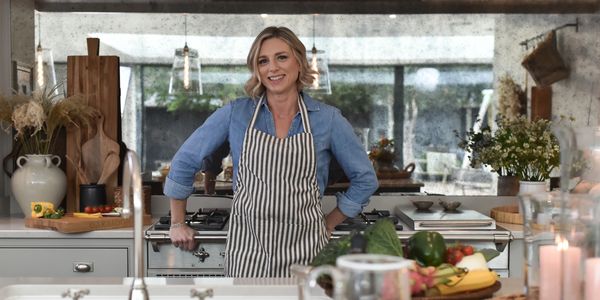 Nutritionist, in kitchen with healthy food. Fresh fruit and vegetables