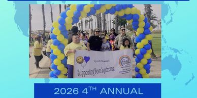 Group holding a banner at the 2026 4th Annual event.