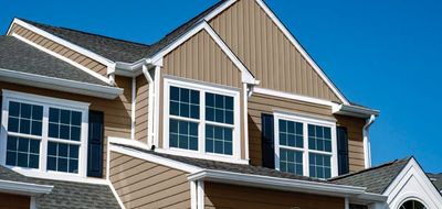 Gentek Board & Batten vertical vinyl siding installed on a residential exterior