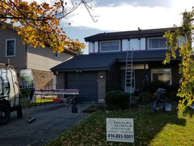 Residential exterior wall showing insulated siding system installation
