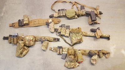 battle belt setup with tactical military gear and molle webbing for shooting