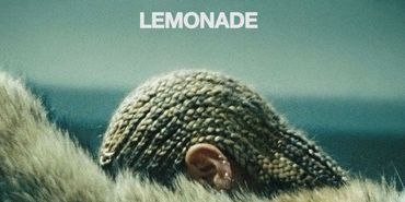 Close-up of braided head with "LEMONADE" text above.