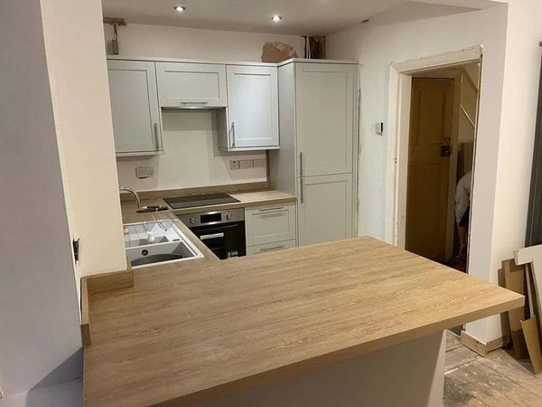 Wall removed to create a Kitchen-Diner. New kitchen and appliances installed.