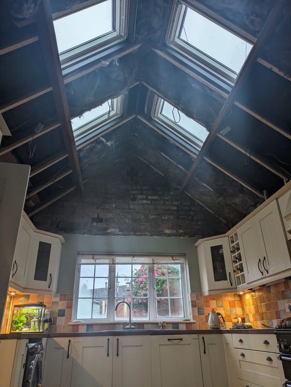 Kitchen ceiling suffered with leaks, customer wanted a vaulted ceiling with electric Velux