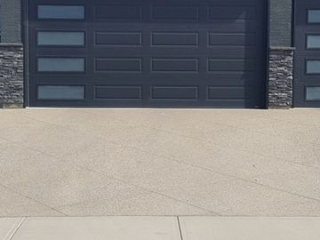 Diamond cuts in an exposed aggregate driveway, we did both in 2017.